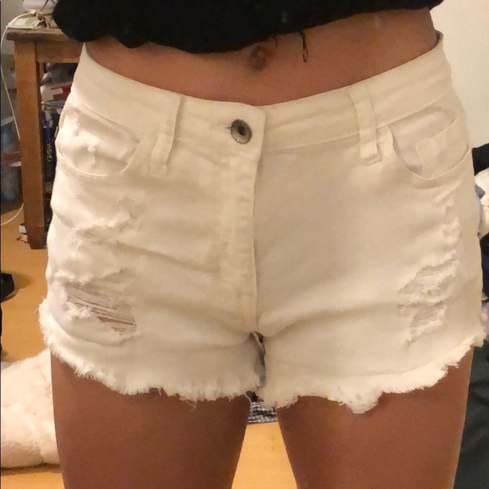 White ripped jean shorts
